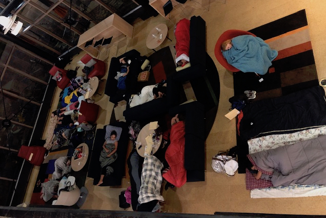 Students sleeping on the floor on Kanbar Campus Center