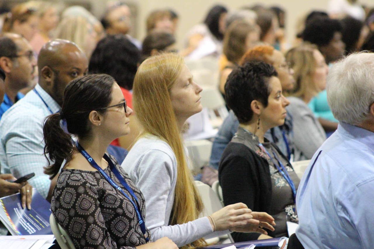 Attendees listen to a lecture