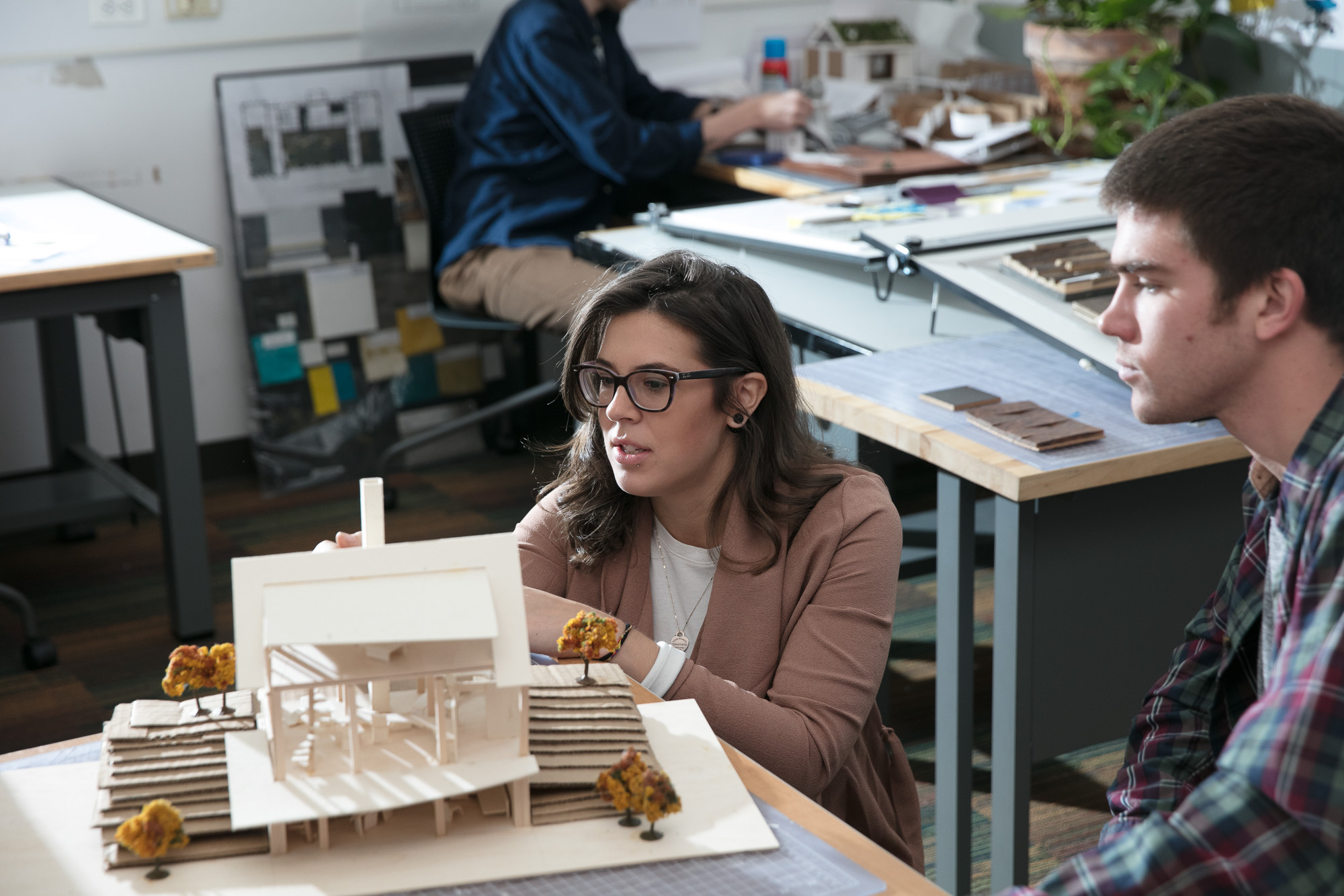 Students working with an architecture model
