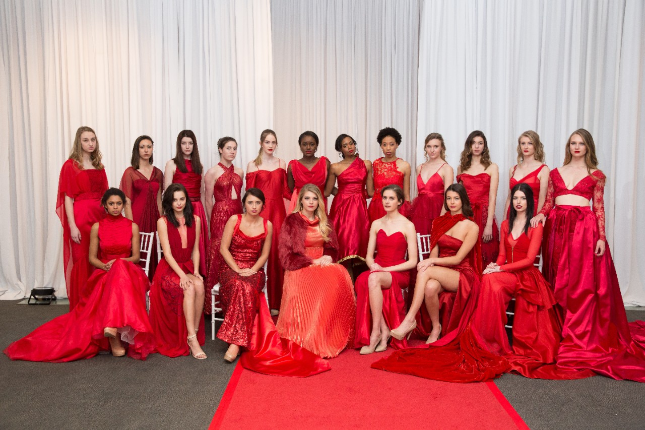 A group of models from Jefferson's annual fashion show wearing red dresses. 