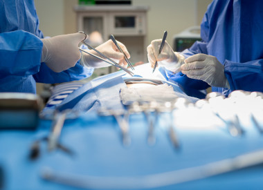 Asian doctor and an assistant in the operating room for surgical venous vascular surgery clinic in hospital.