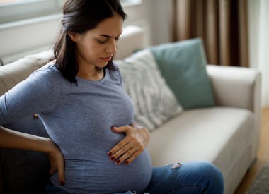 Young pregnant woman suffering from backache
