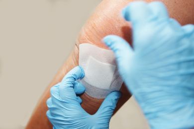 wound covered by dressing and bandaid