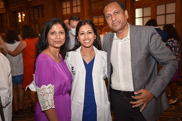 Class of 2025 student Alisha Goyal poses with loved ones at the July 23, 2021 White Coat Ceremony.