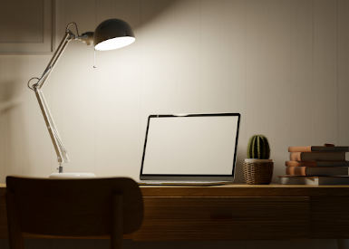 1330143323 Home office space at night with low light, tablet with blank empty screen, modern table lamp, mock up frames and decor on wood table, 3d rendering, 3d illustration