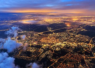 Beautiful aerial cityscape view of the city of Leiden, the Netherlands, after sunset at night in the blue hour