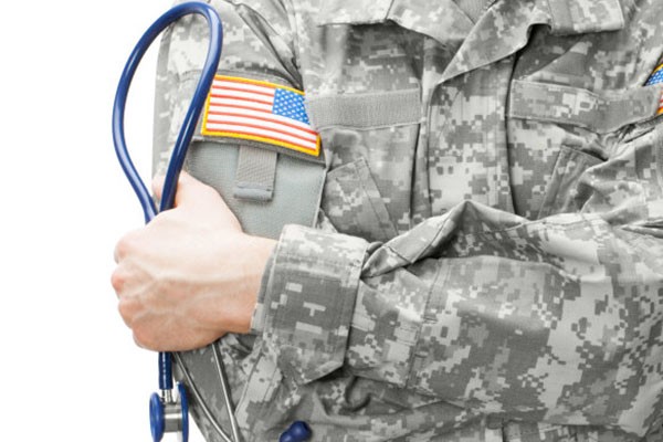 US Army doctor holding stethoscope near his shoulder