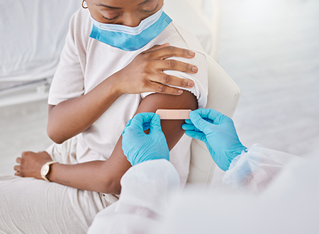 Covid vaccine, mask and nurse giving plaster to patient. Medical worker covering arm with care after doing checks in lab. Consulting, trust and medicine for virus immunity and science