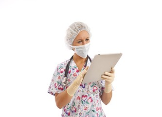 Portrait of young nurse using a touch screen computer