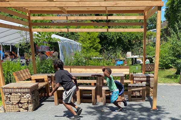 children running around park in a truck landscape