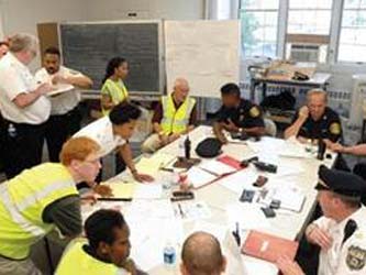 First responders have a discussion in a conference room