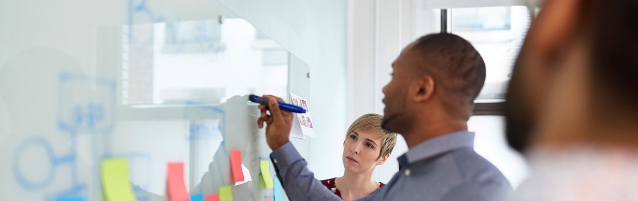 Group of young and trendy businessmen and businesswomen people during a brainstorm session for their small company