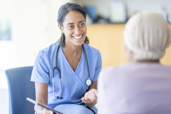Smiling nurse with patient