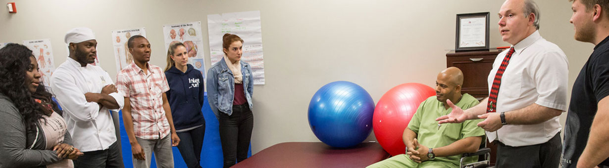 Students practicing occupational therapy techniques at Thomas Jefferson University's East Falls campus, preparing for careers as occupational therapy assistants.