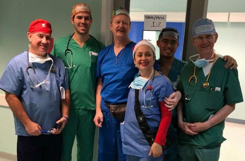 Surgical team operating on a patient