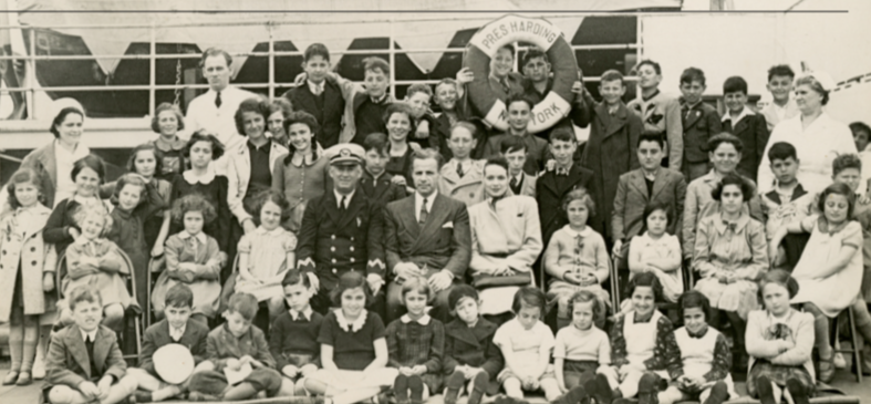 Gilbert and Eleanor Kraus (center) and the 50 children aboard the SS President Harding. Courtesy of PerlePress Productions