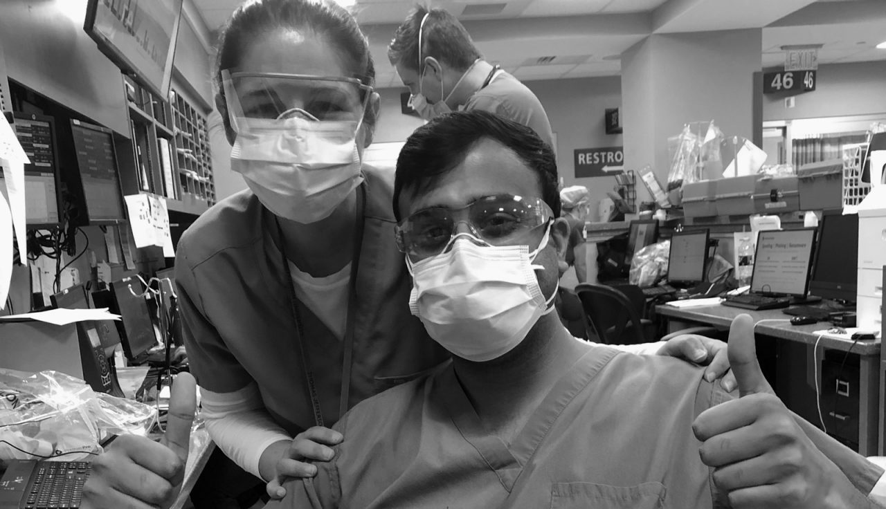 Dr. Jen White and a coworker, both in masks