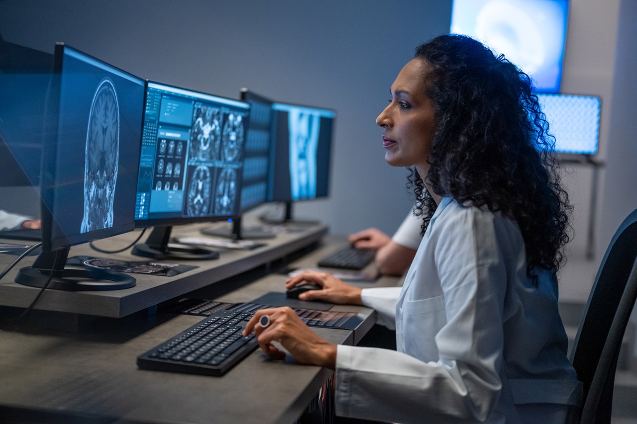 Female doctor analyzing medical scan result