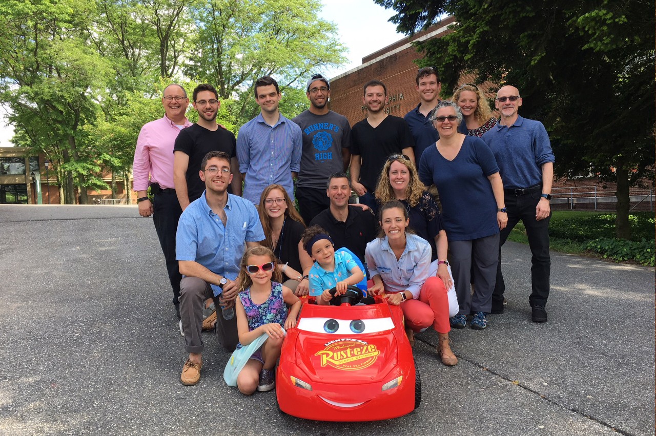 engineering students helping out a boy with special needs