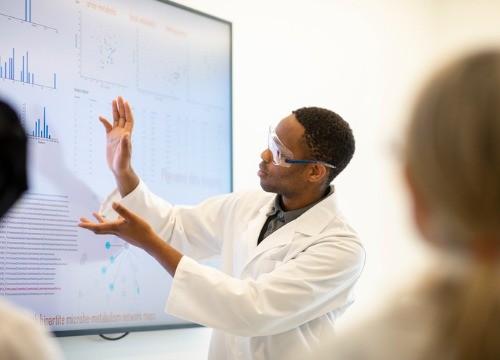 Scientist displaying data on a screen