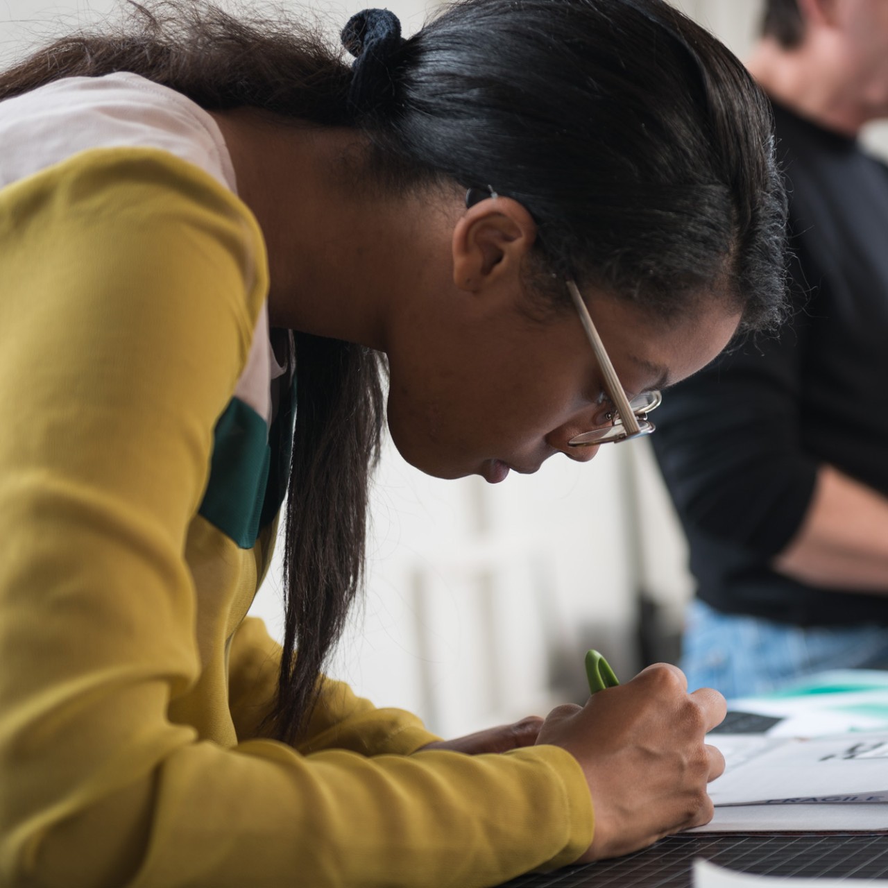 Female design student working on table