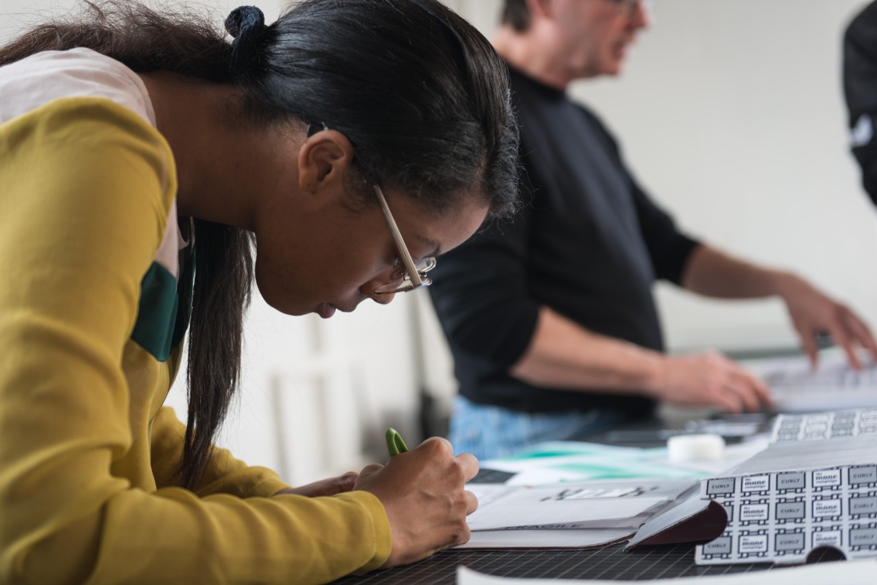 Female design student working on table