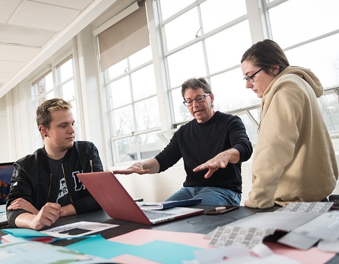 Students working with professor