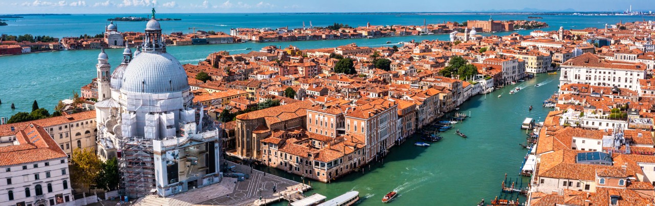 Aerial panoramic cityscape of Venice with Santa Maria della Salute church, Veneto, Italy.