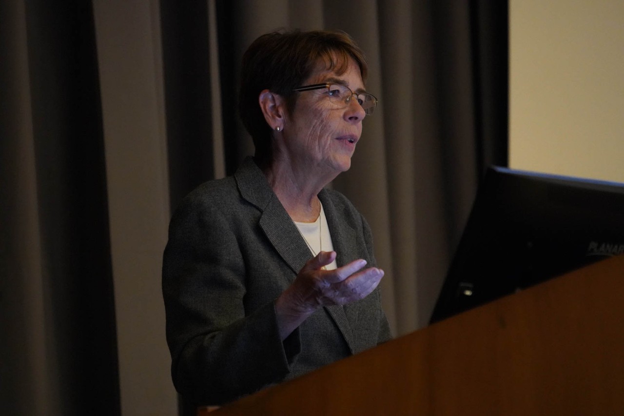 Woman giving speech at lectern