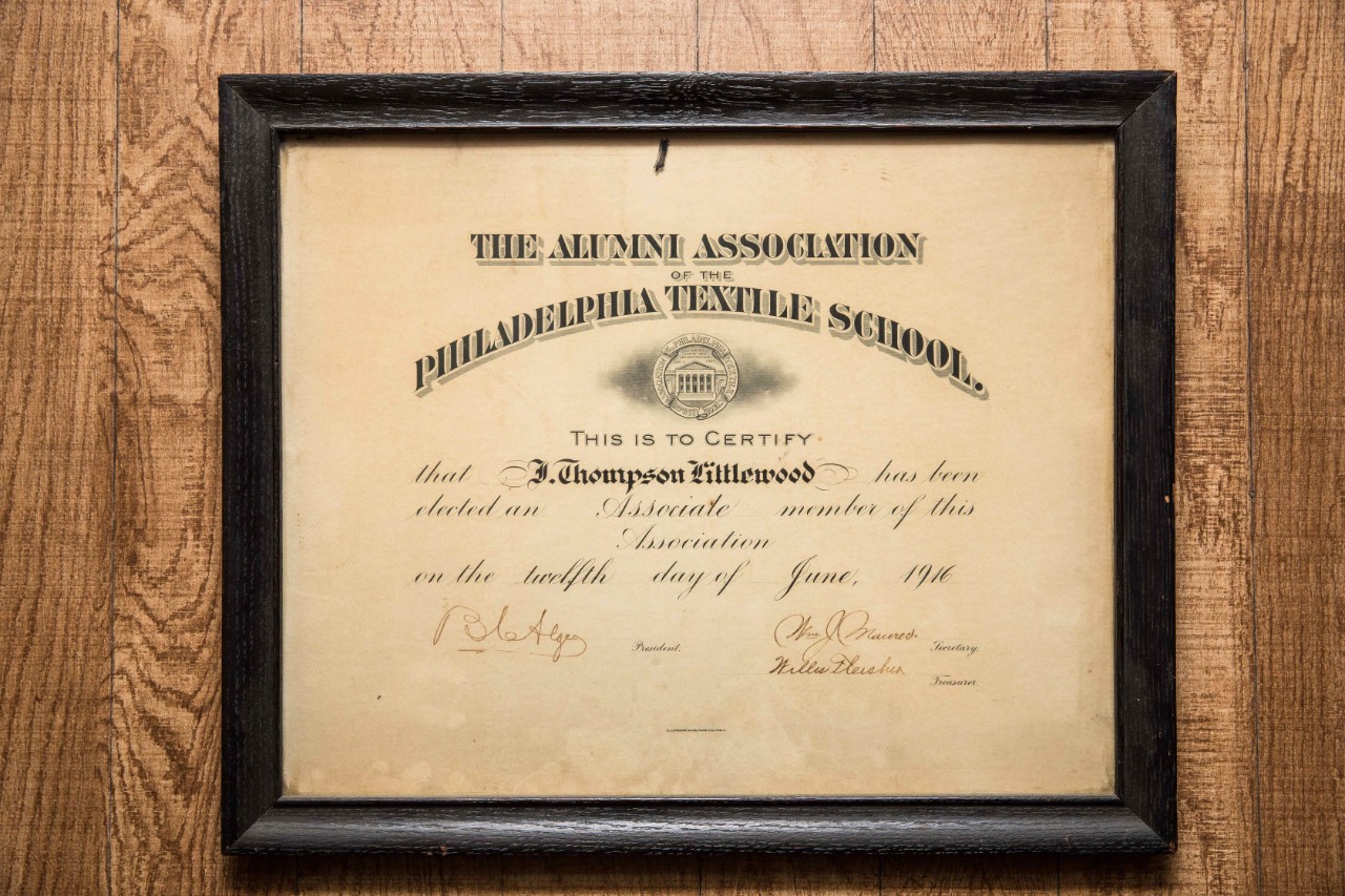 Alumni association certificate on wall