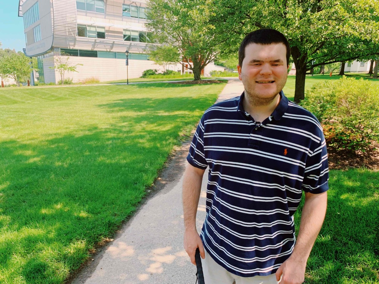 Nick Gomberg stands in front of the DEC Building on East Falls Campus