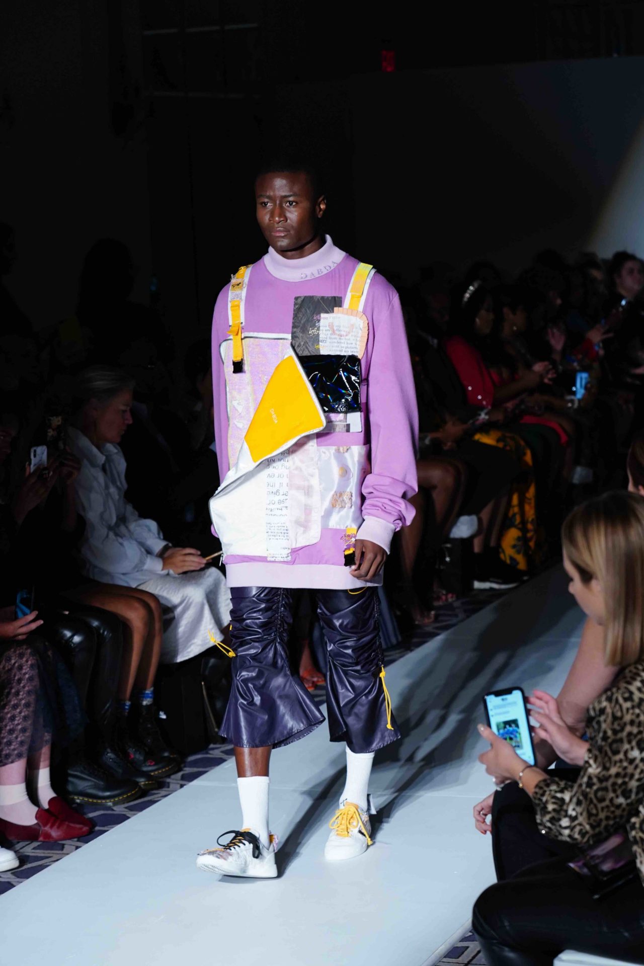 model walks down the runway