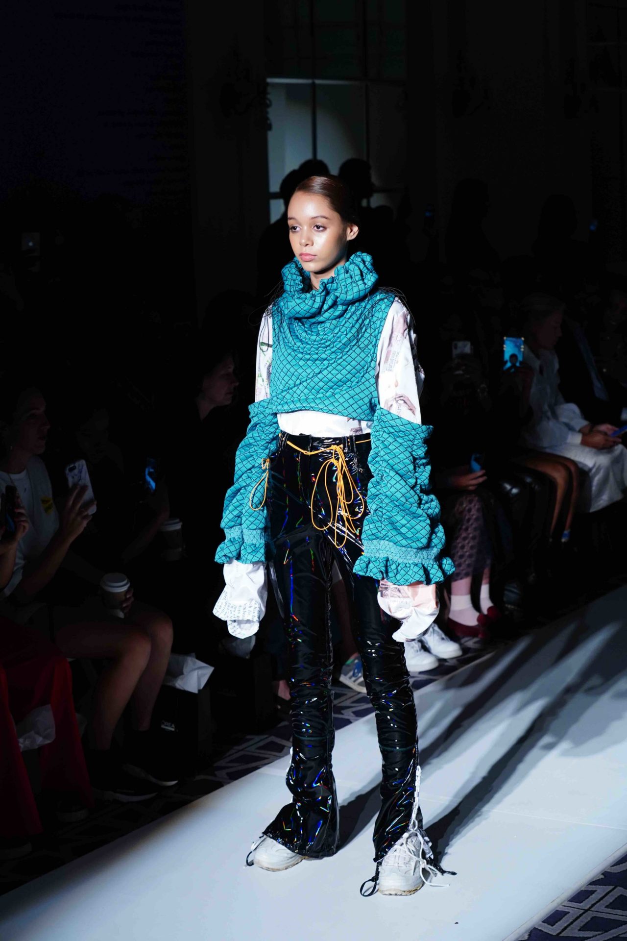 model walks down the runway