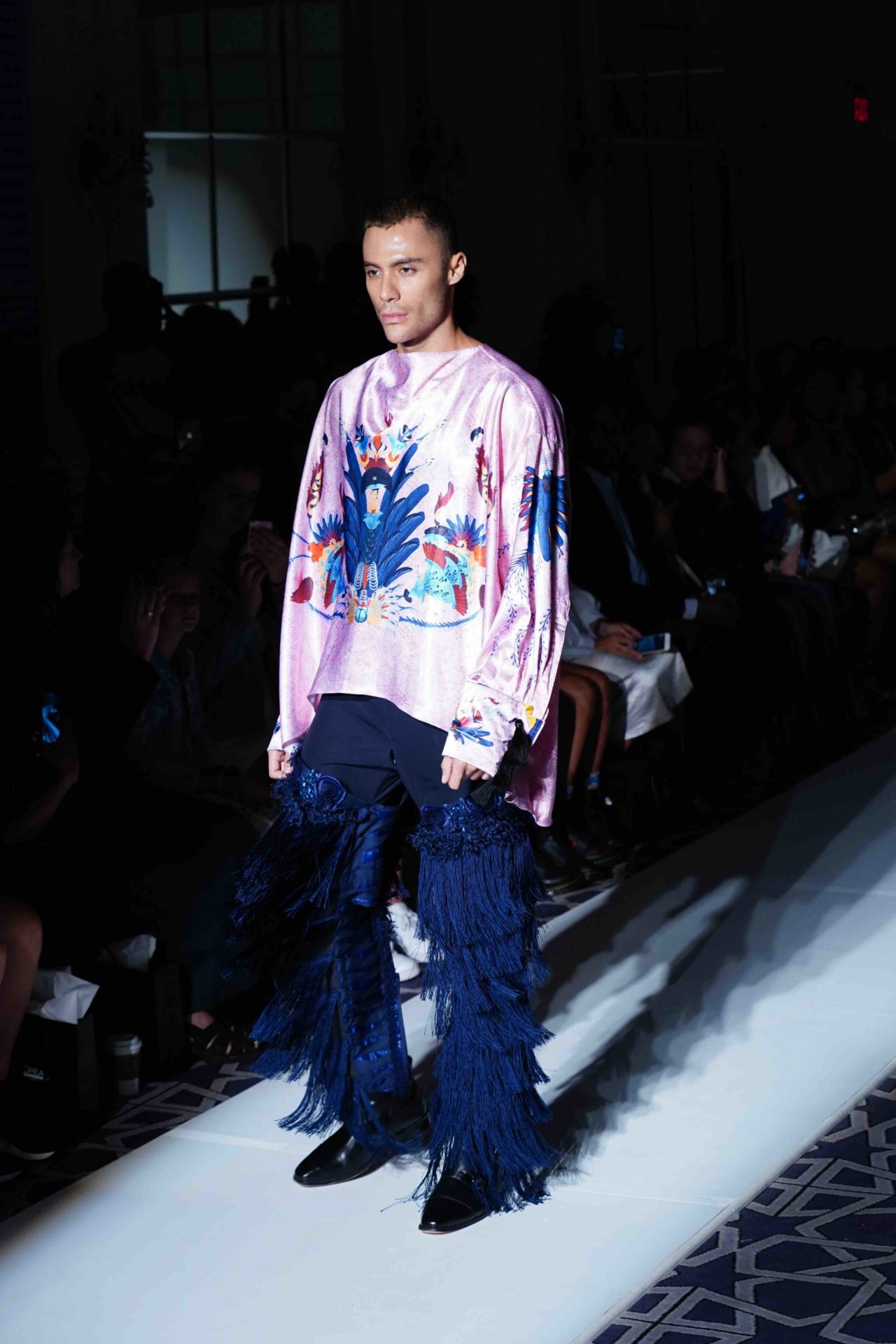 model walks down the runway