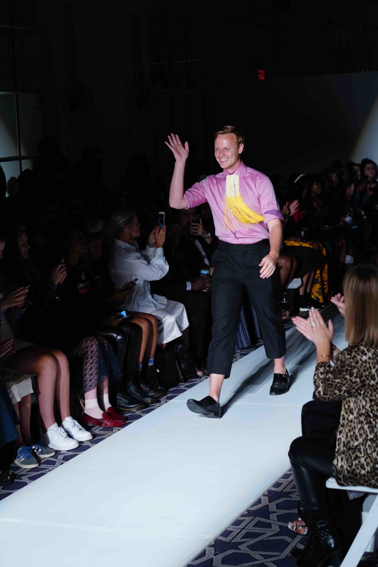 designer walks down runway