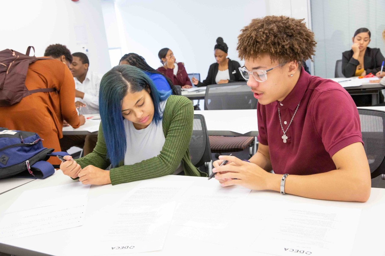 Two students preparing for roleplaying exercises