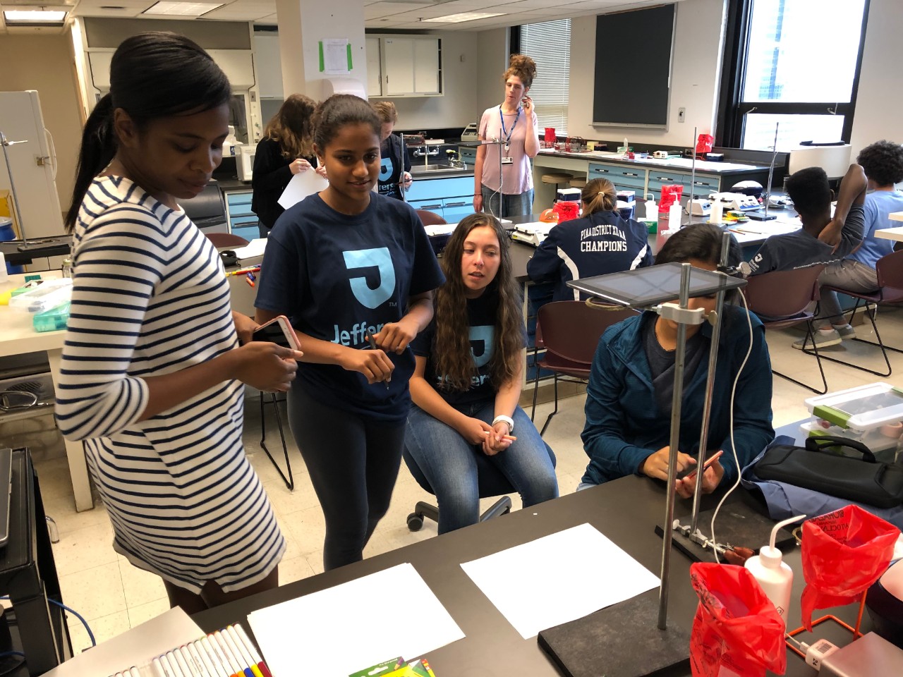 grad student with high school students