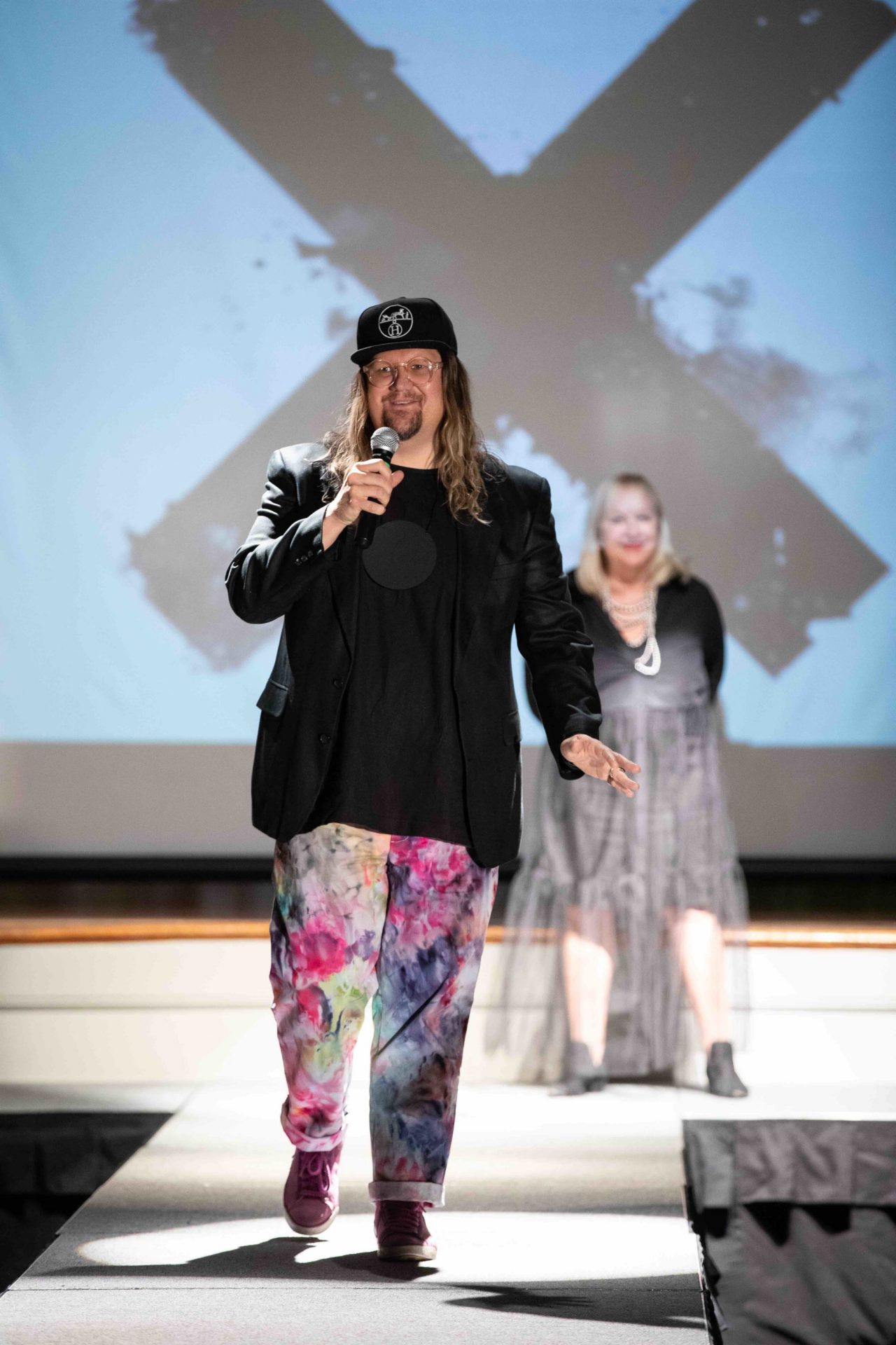 Jay McCarrol speaking on runway