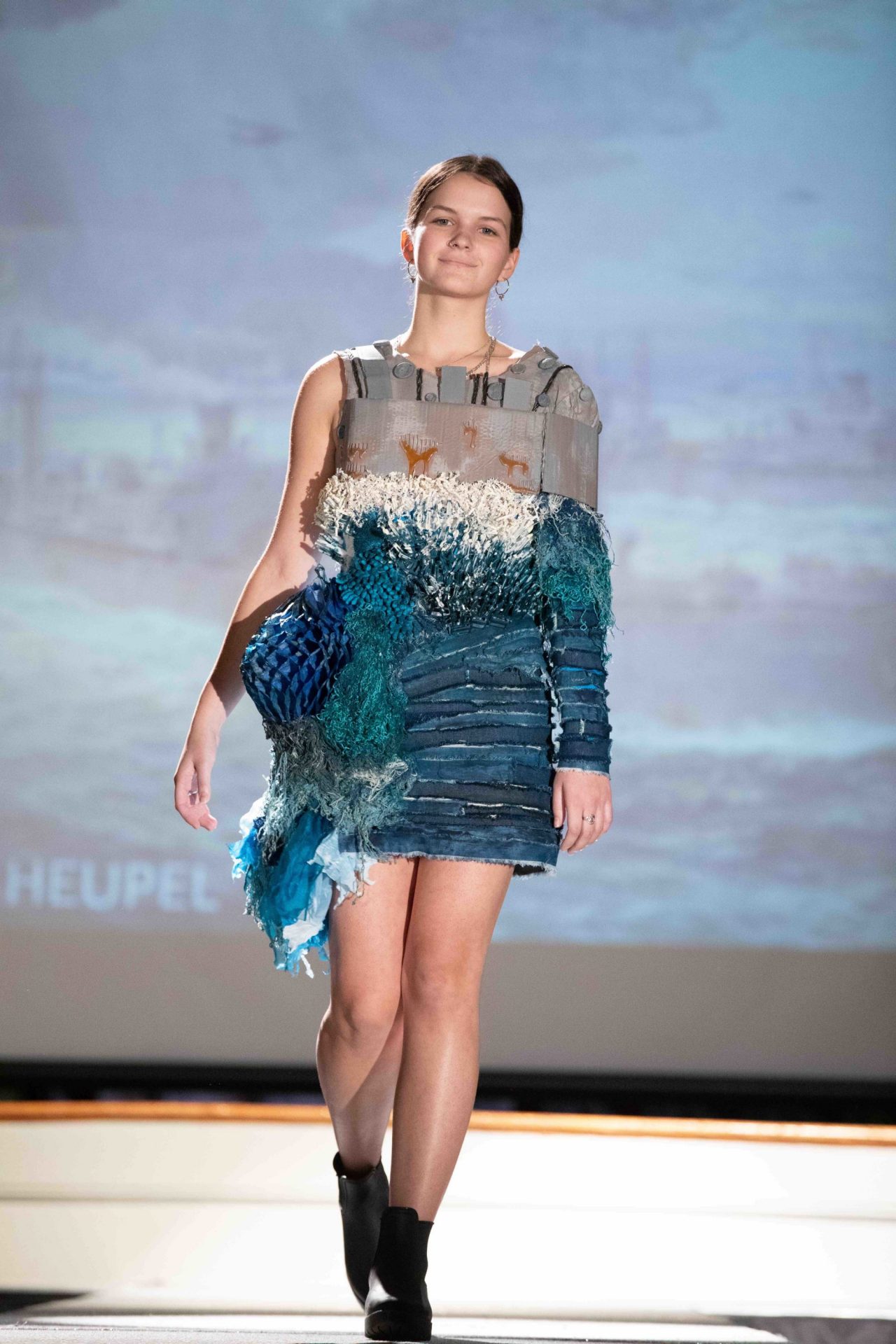 Model walking down runway
