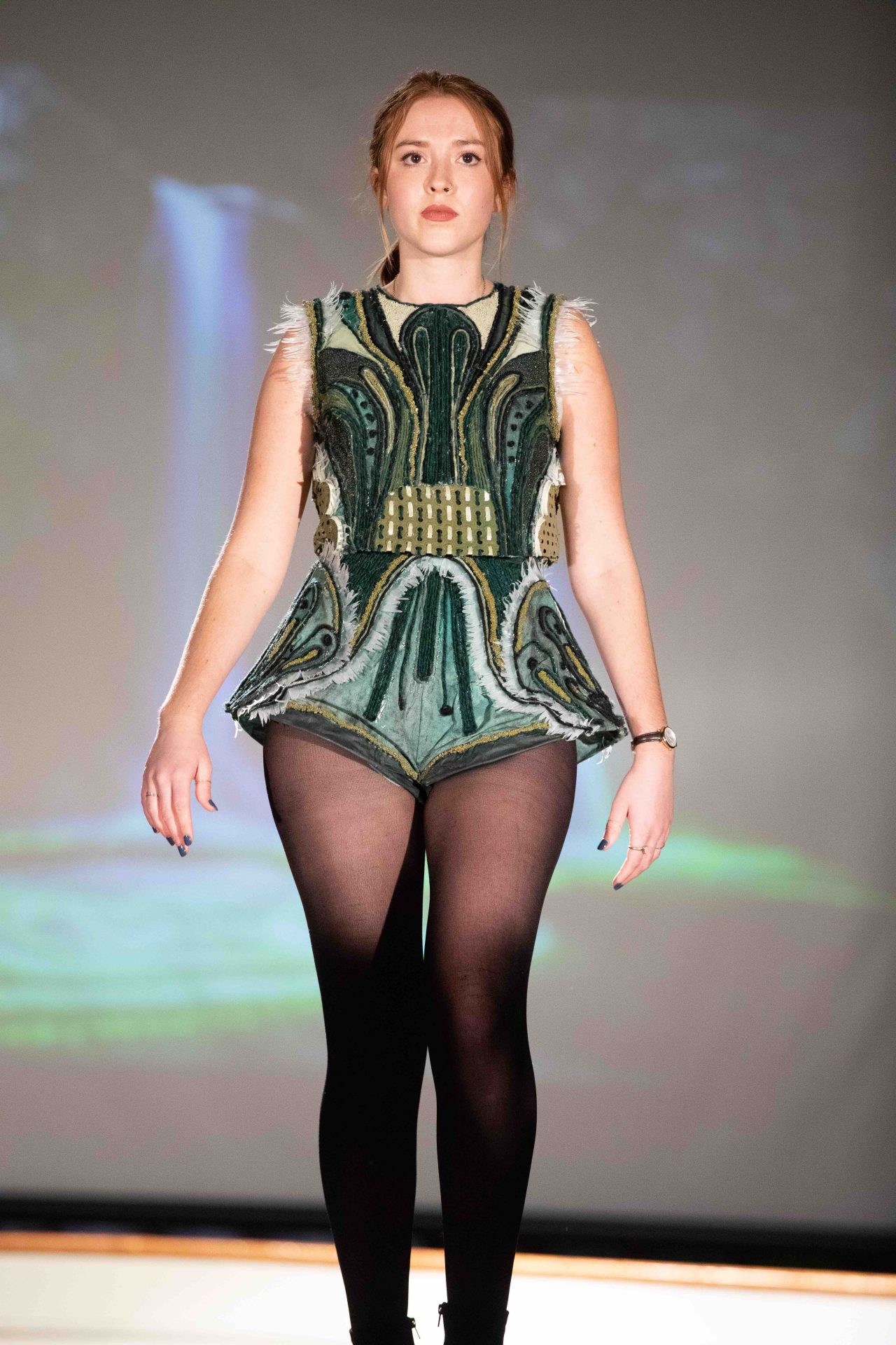 Model walking down runway