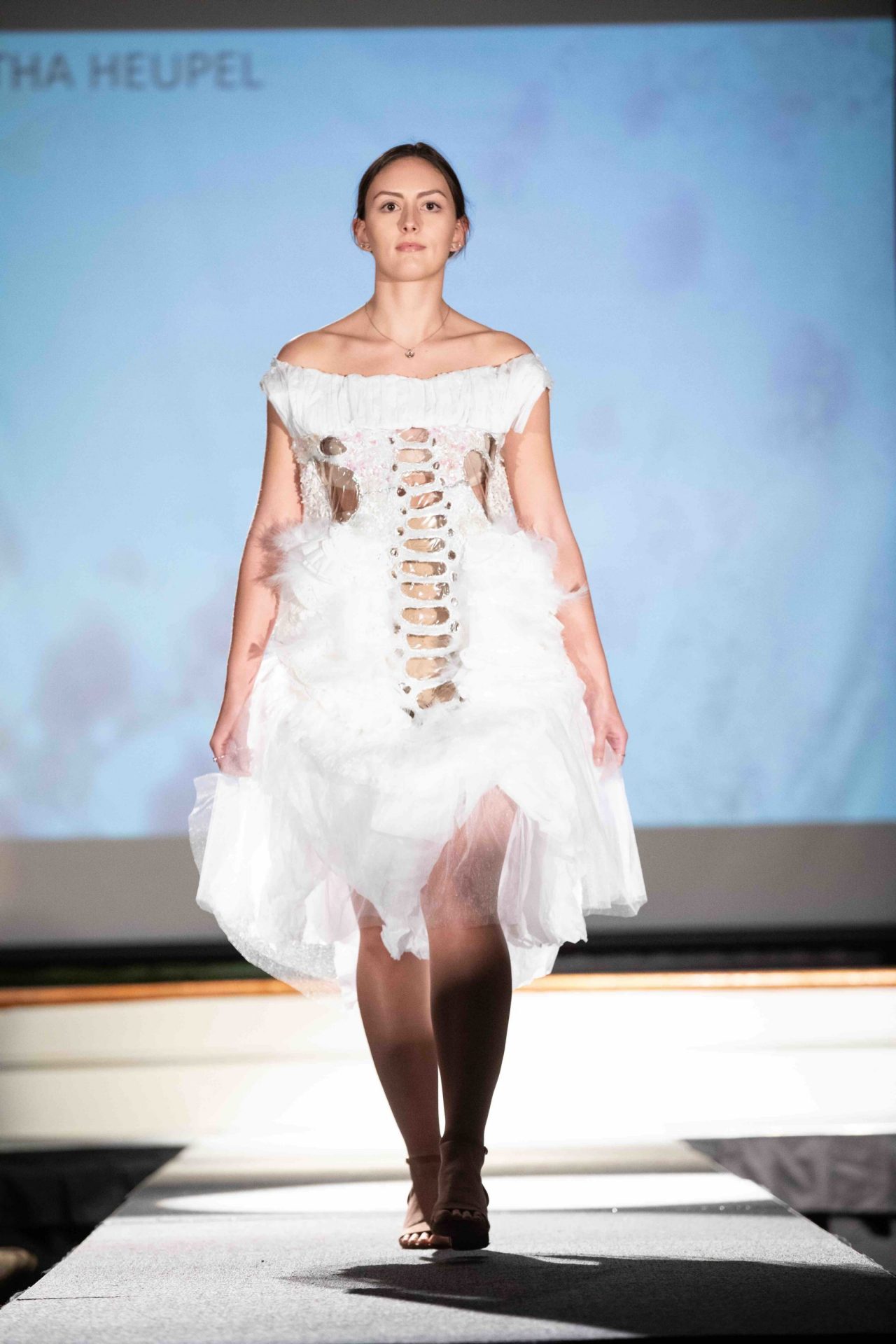 Model walking down runway