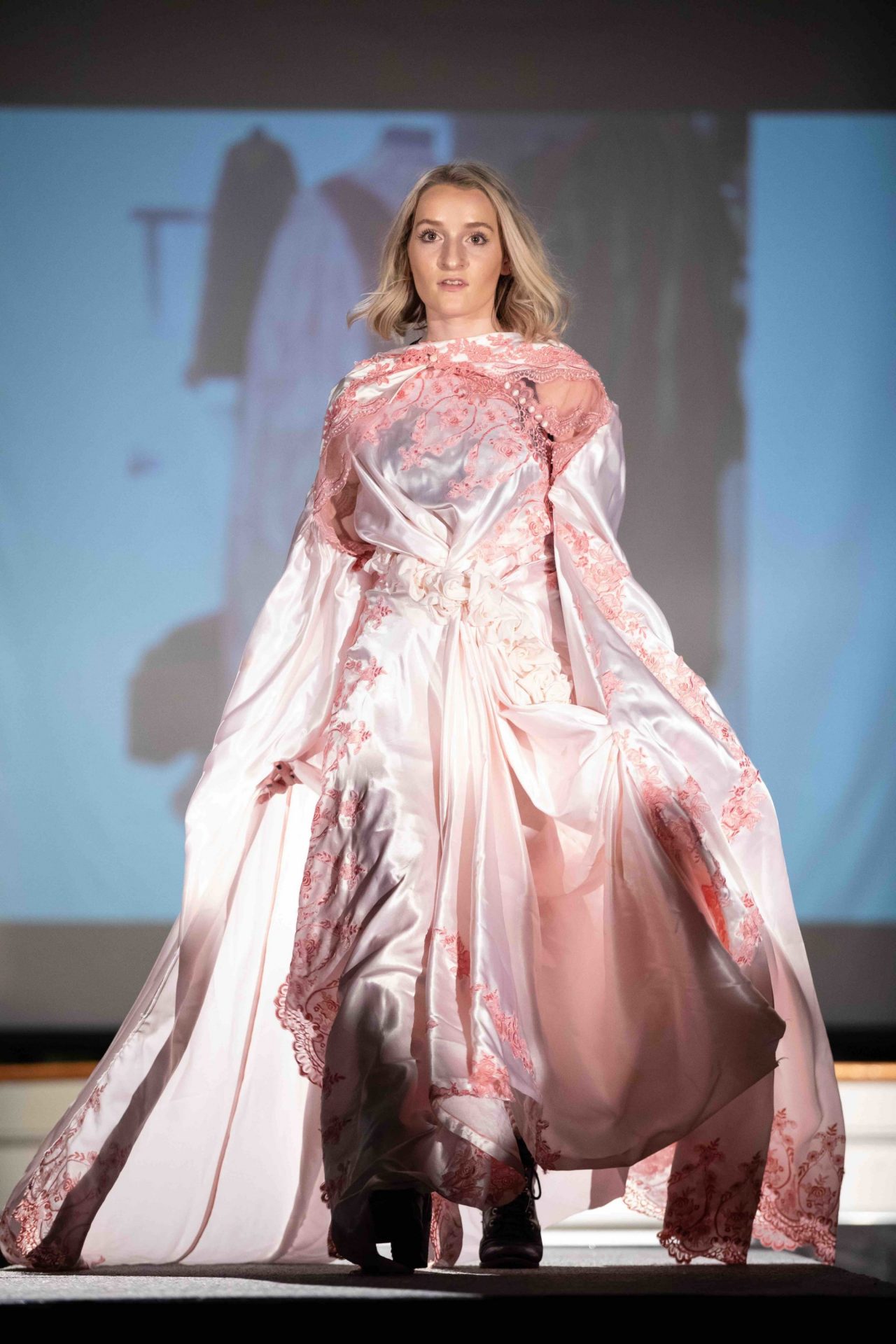 Model walking down runway