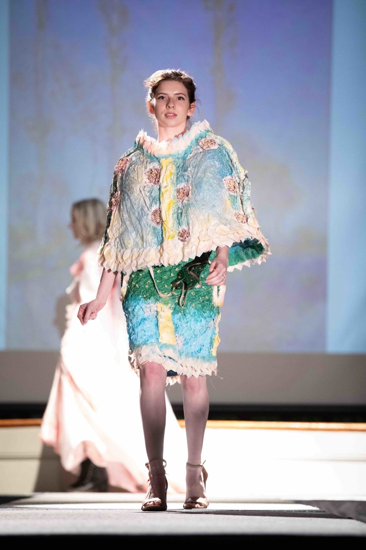Model walking down runway