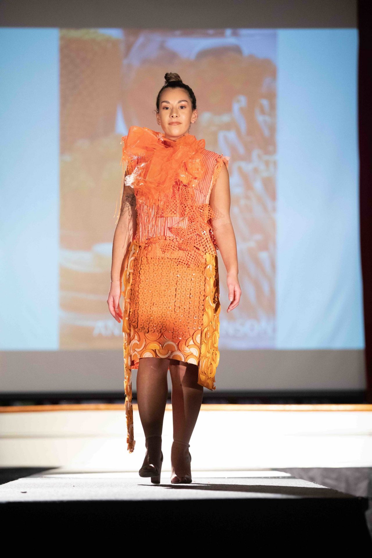 Model walking down runway
