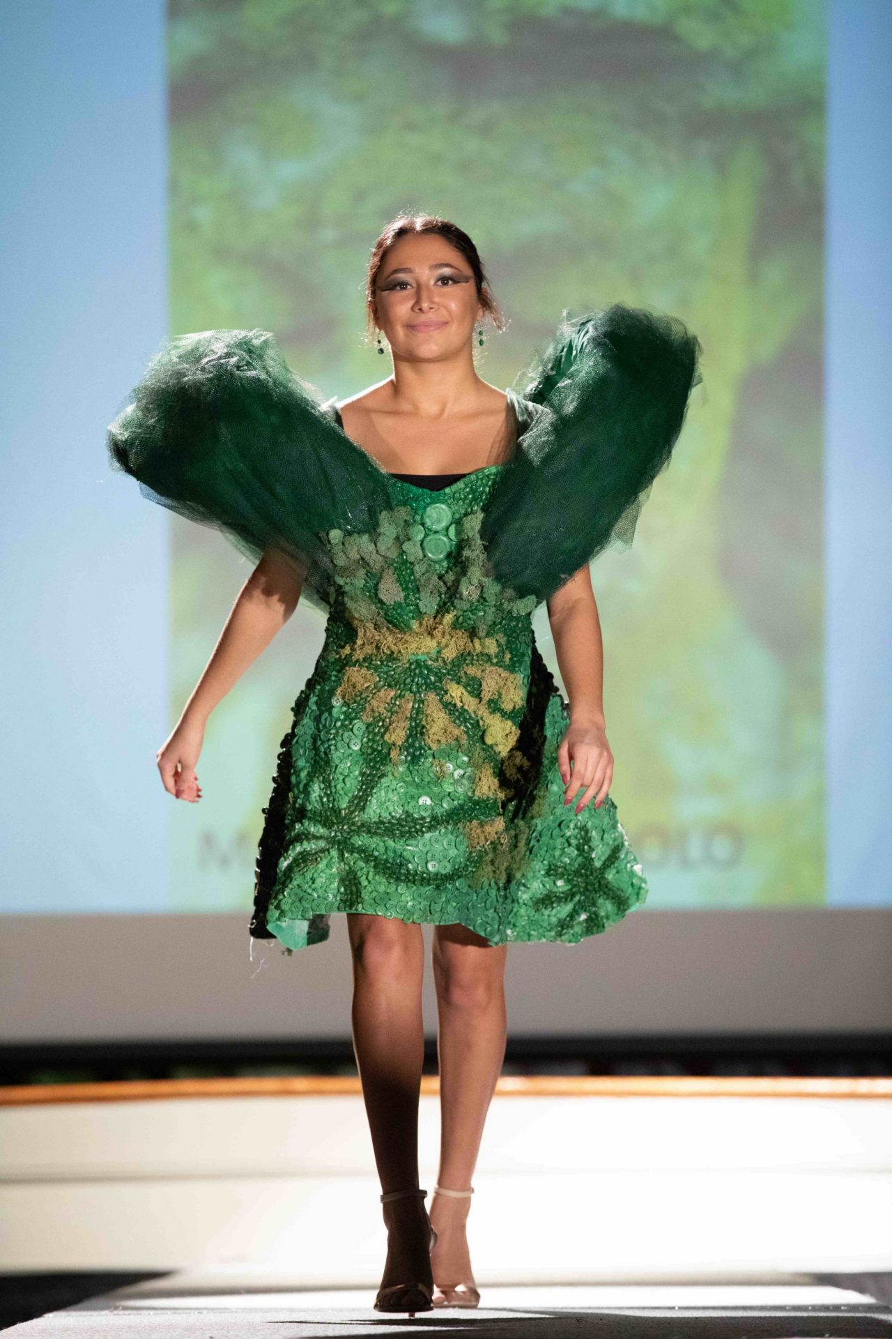 Model walking down runway
