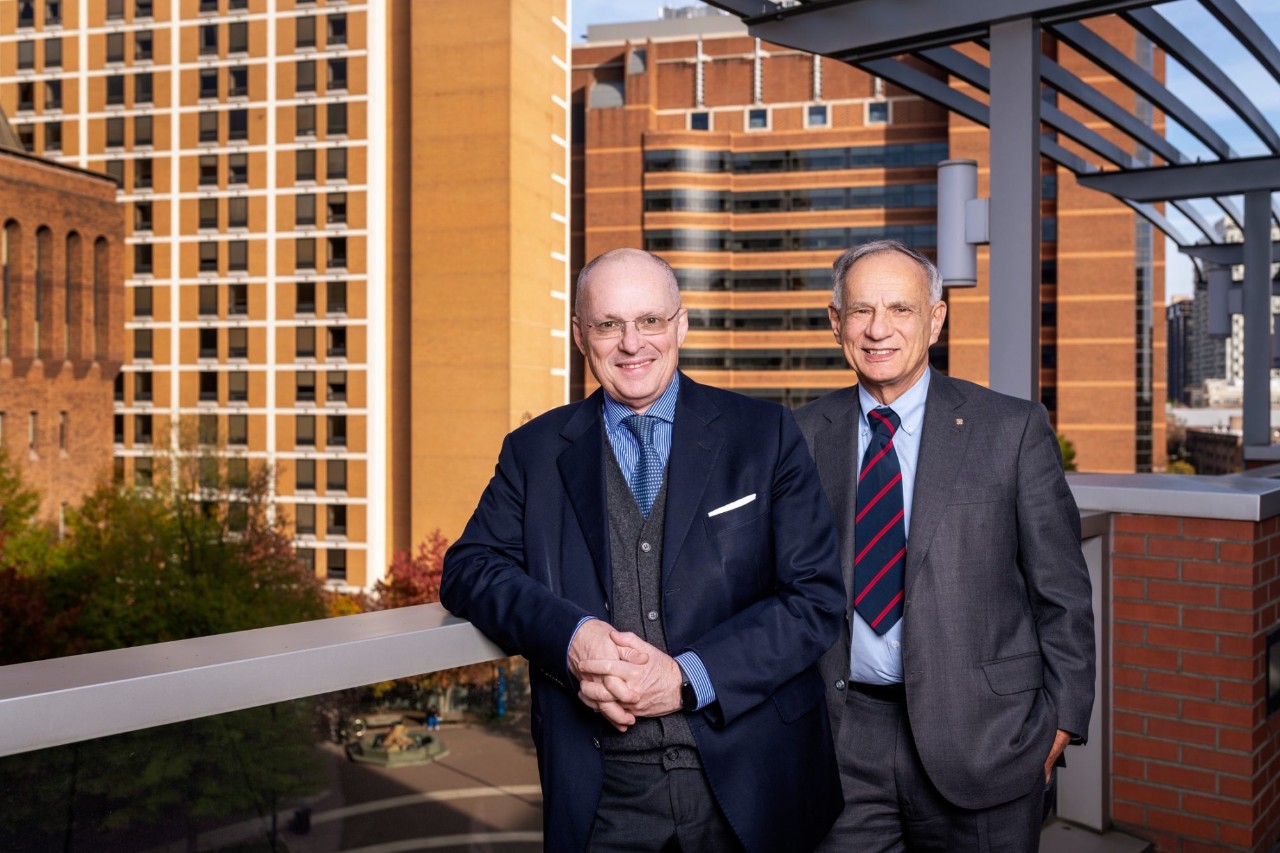 Drs. Ricciardi and Scoles pose outside