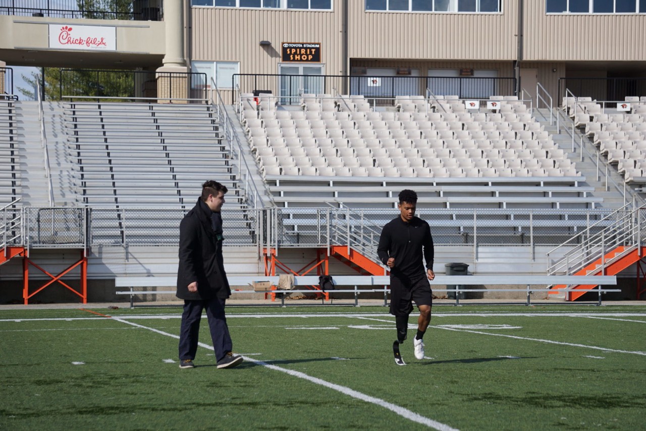Kody Kasey practices in the new cleat attachment