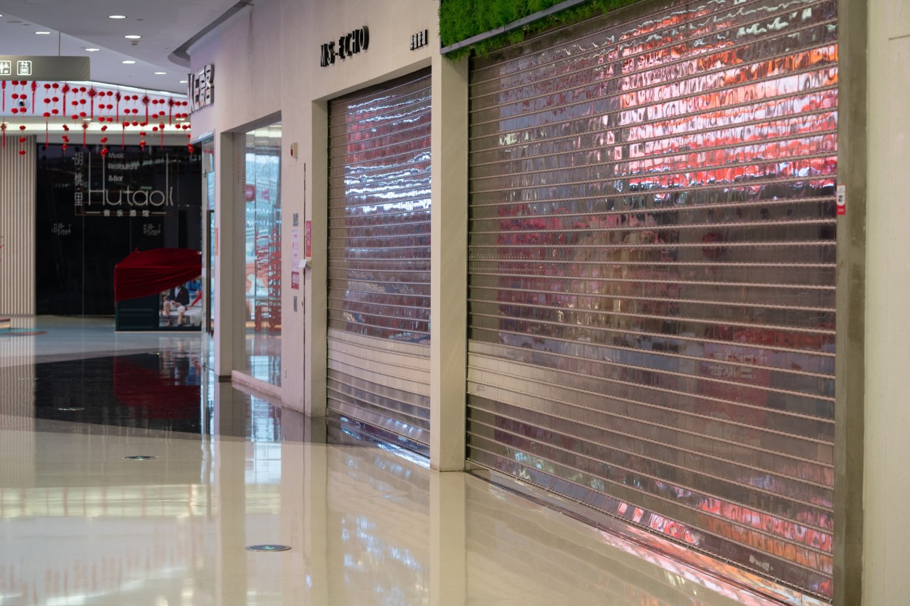 Empty shopping mall with closed shops during first day of the lockdown of the city to prevent coronavirus epidemic in Wuhan China