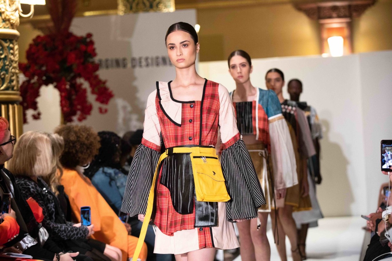 Models walk down the runway at NYFW