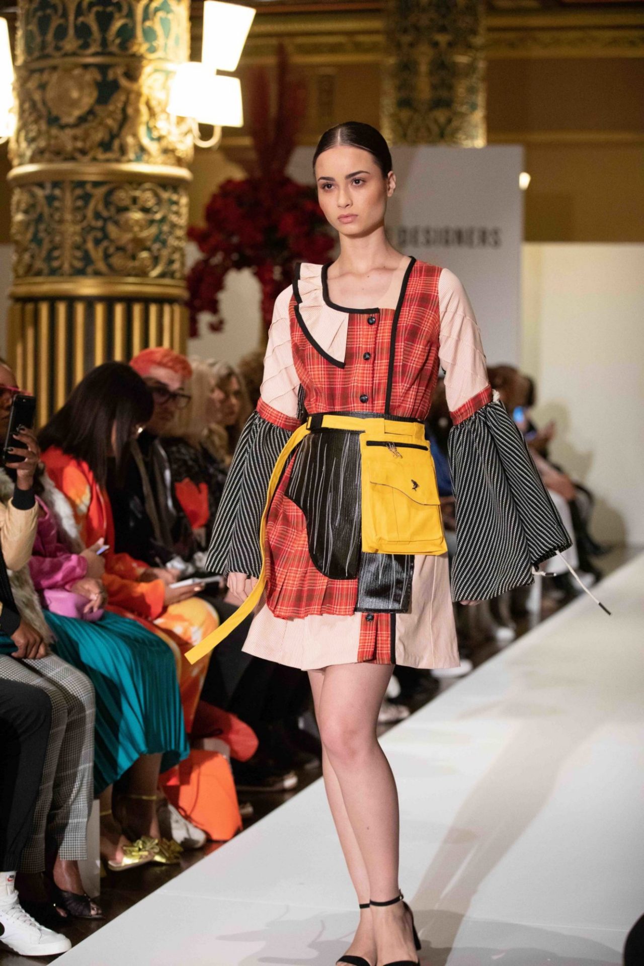 Model walks down the runway at NYFW